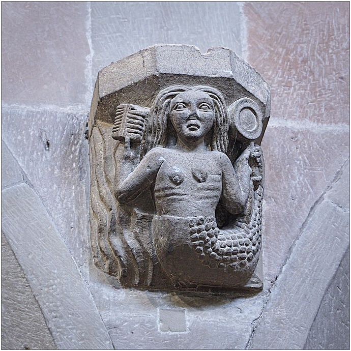WREXHAM - Mermaid with comb & mirror corbel, C14th, signifiying vanity.