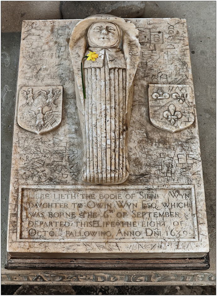 LLANRWST - graffitti'd memorial.